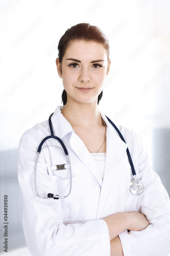 Doctor woman cheerful smiling at camera. Perfect medical service in clinic. Happy future in medicine and healthcare Doctor woman cheerful smiling at camera. Perfect medical service in clinic. Happy future in medicine and healthcare