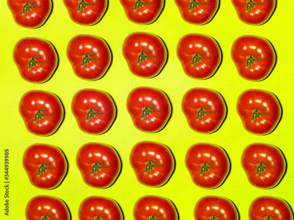 Colorful pattern of fresh tomato on a light green background. Top view Colorful pattern of fresh tomato on a light green background. Top view