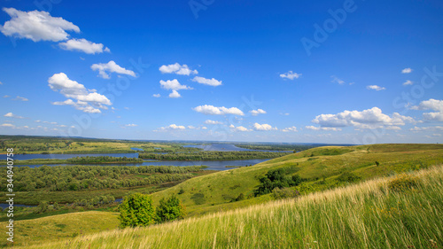 beautiful hills on the high bank of the river Vyatka on a sunny day in summer © Андрей Пугачев