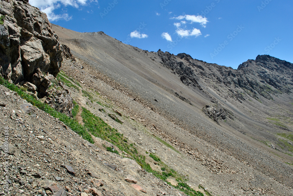 road in the mountains to the mountain pass blue sky