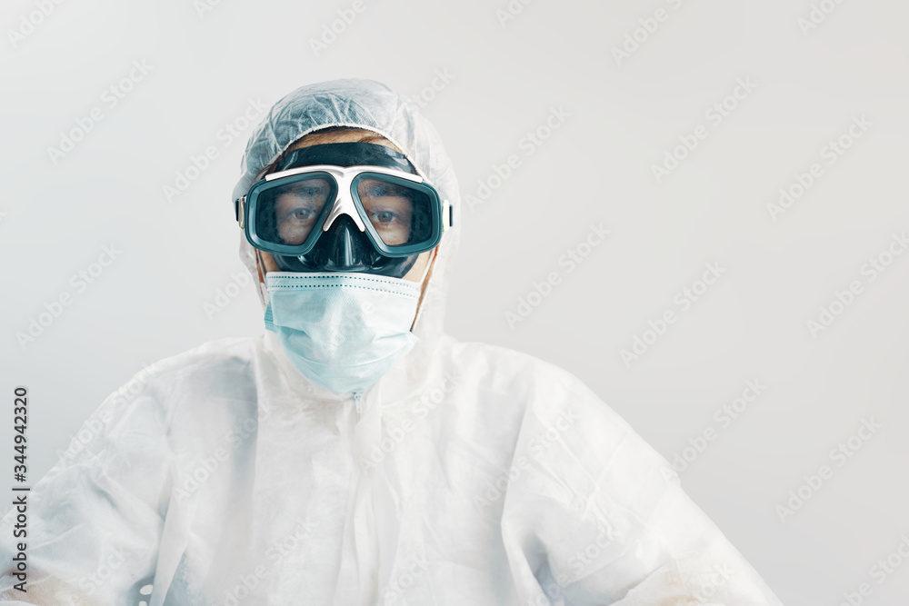 Virologist. Male professional in hooded suit for bio-hazard protection Virologist. Male professional in hooded suit for bio-hazard protection