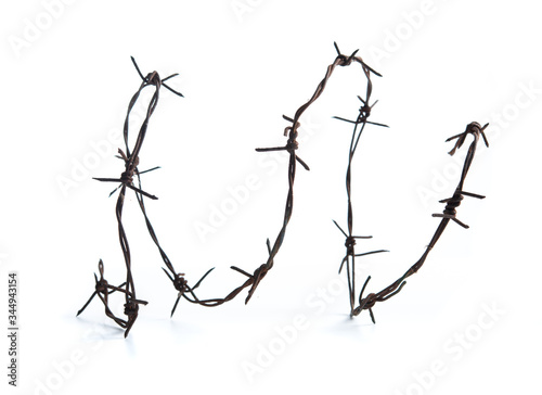 Obraz na płótnie Old rusty metal barbed wire isolated on white background