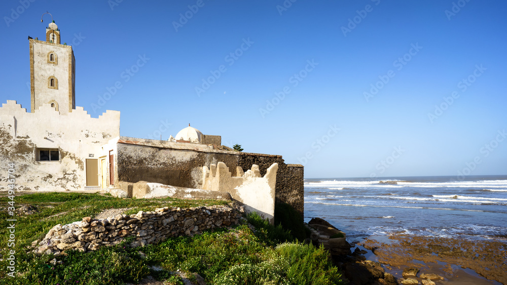 The characteristic mosque by the ocean in Zaouiet Bouzarktoune, near Essaouira, Morocco