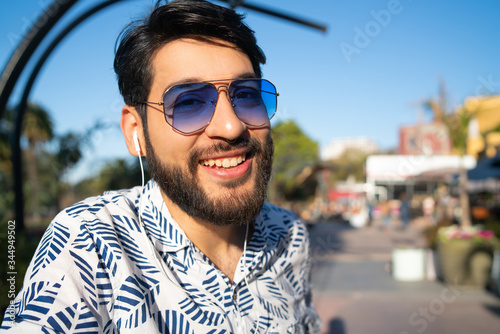 Man listening to music with earphones.