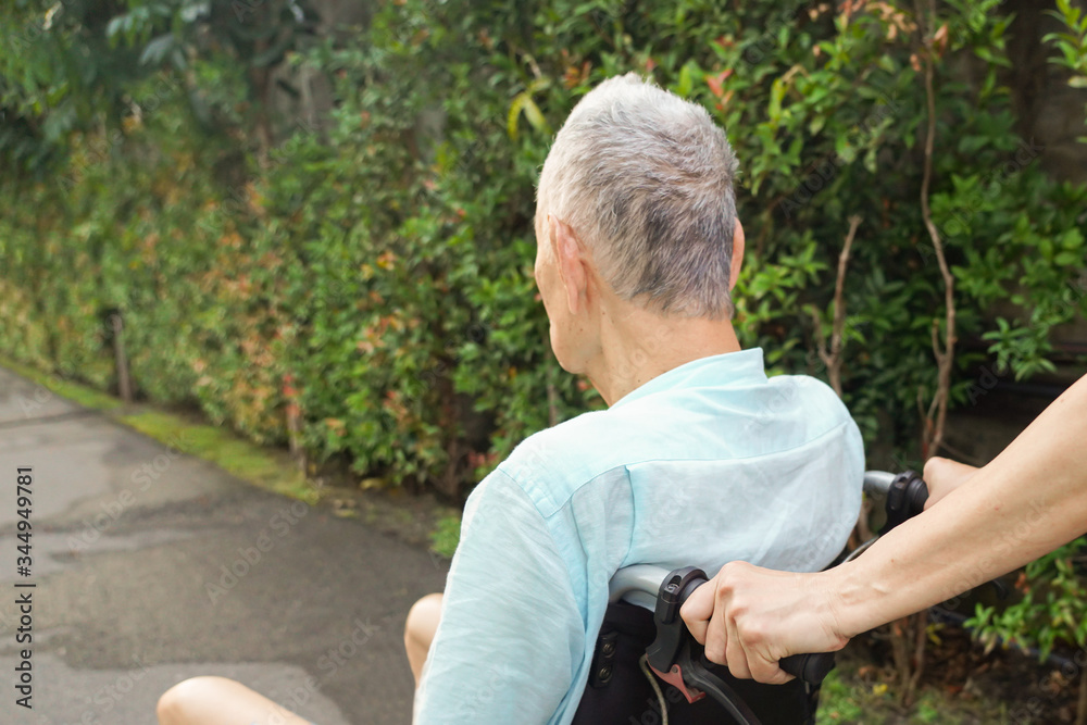 Woman Support Elder on Wheelchair Woman Support Elder on Wheelchair