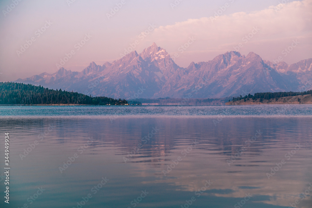 purple mountains and reflection of  grand tetons in wyoming