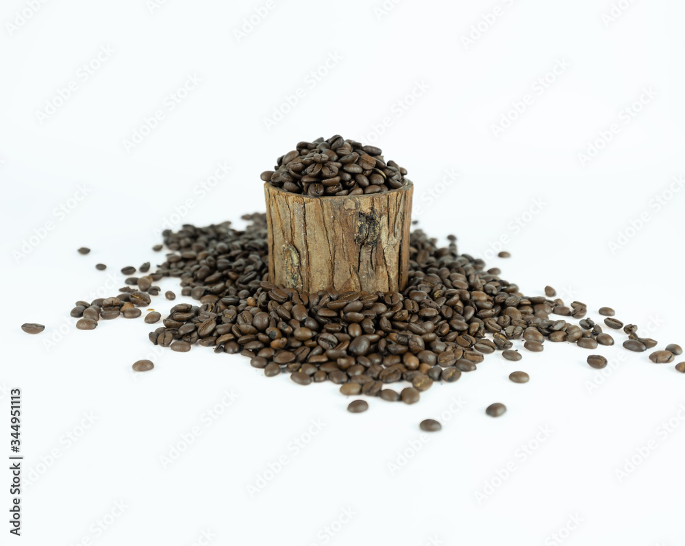 Coffee beans lying on small stump and around