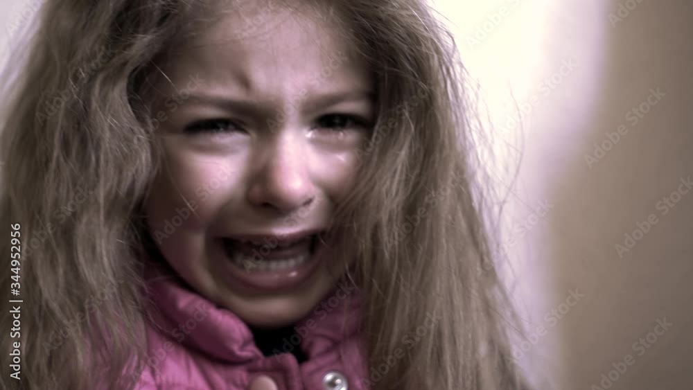Little girl crying. Tears on face of child. Scared, sad and unhappy face of girl aged 5. Social awareness and children. Little girl crying. Tears on face of child. Scared, sad and unhappy face of girl aged 5. Social awareness and children.