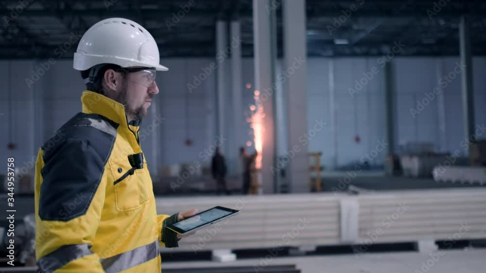 Architect or engineer working, browsing building project indoor of construction site with blueprint plan. businessman worker, man male construction engineers or architects working people. Engineer In