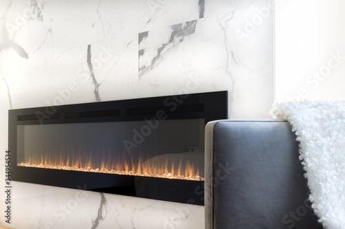 Modern fireplace in marble wall