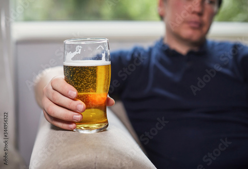 Man holding a pint of beer