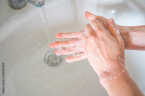 Washing hands rubbing with soap man for corona virus prevention  hygiene to stop spreading coronavirus.