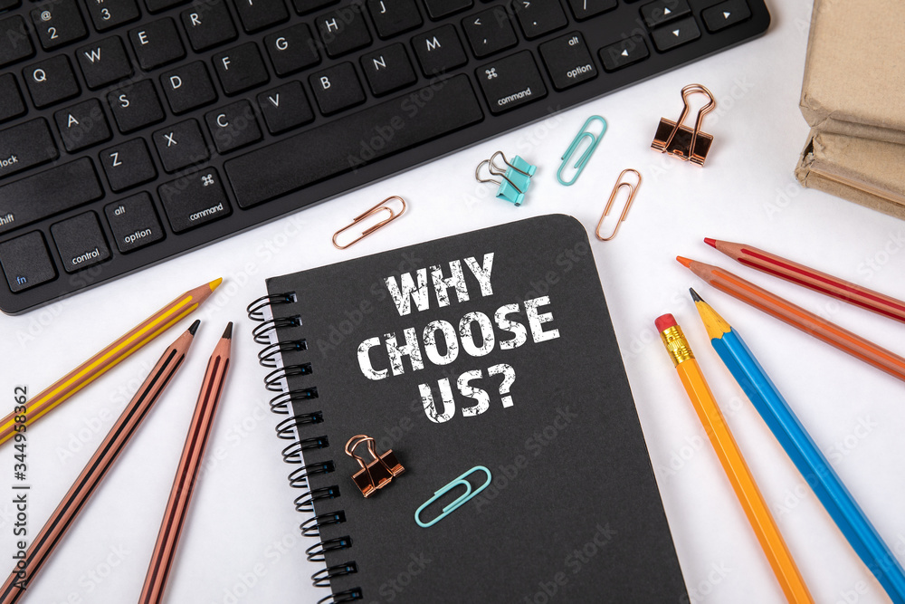 WHY CHOOSE US. Black notebook and computer keyboard WHY CHOOSE US. Black notebook and computer keyboard