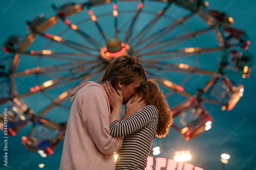 Couple Having Fun At An Amusement Park Stock Photo | Adobe Stock