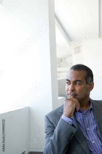 Portrait of thoughtful businessman sitting in office