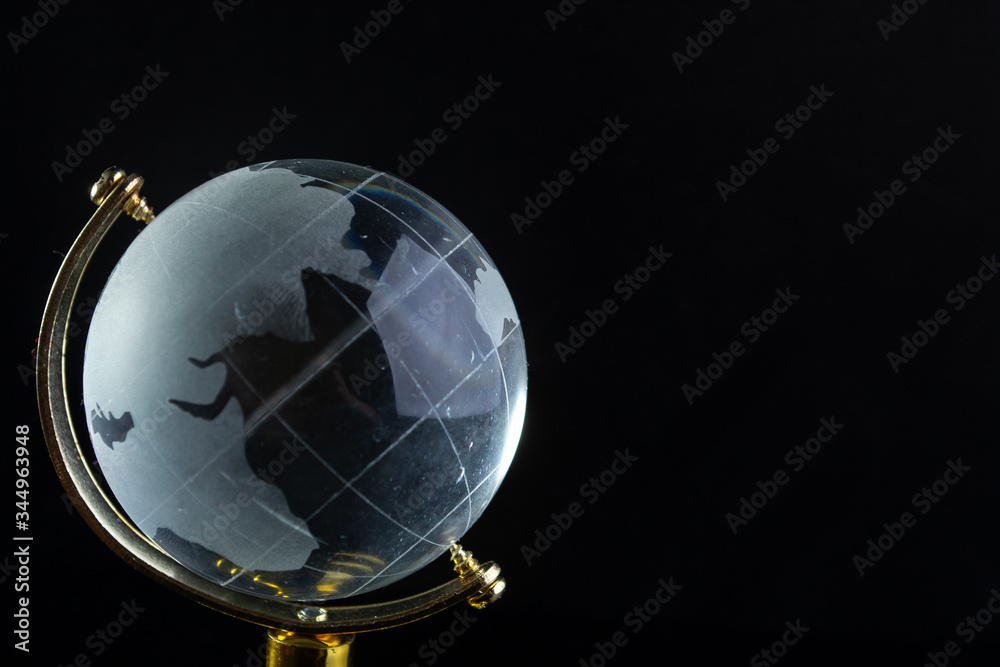Glass globe on a black matte background