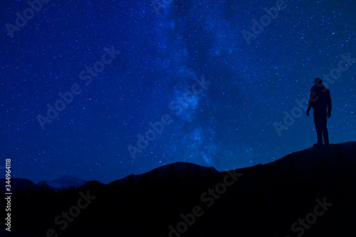StarGazing At Night Silhouette In Mountains In Summertime