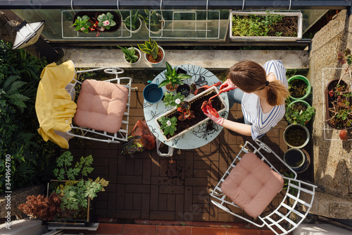 Young woman planting flowers