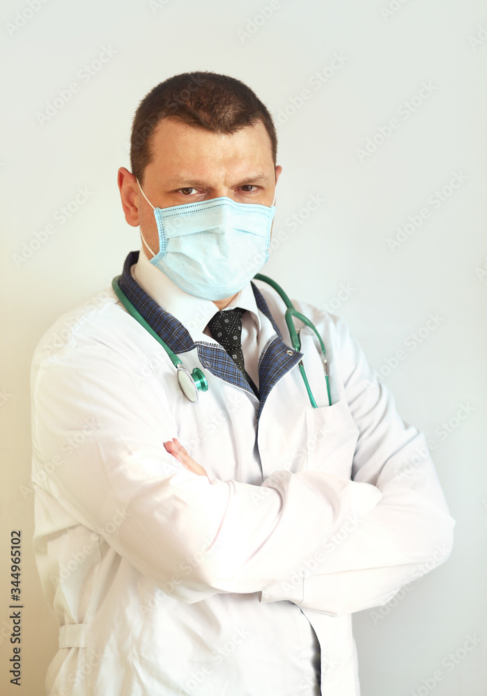 Doctor pediatrician wearing a protective mask against coronavirus. Banner panorama, medical staff, preventive equipment. Pandemic.  
Healthcare concept