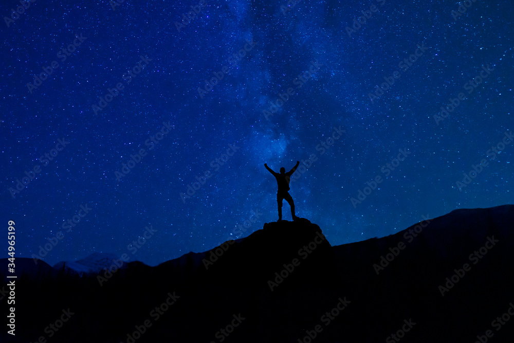 Victorious Silhouette Under Stars And Milky Way Night Skies In Summer