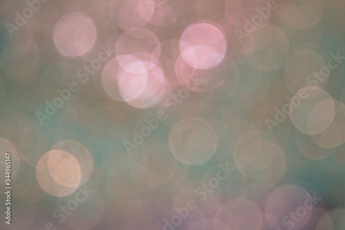 Beautiful colorful festive blurred background for christmas design, copy space. Unique powder pink and emerald green and light gold color backdrop. 