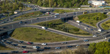 Top view of the road junction of motorways with cars. 