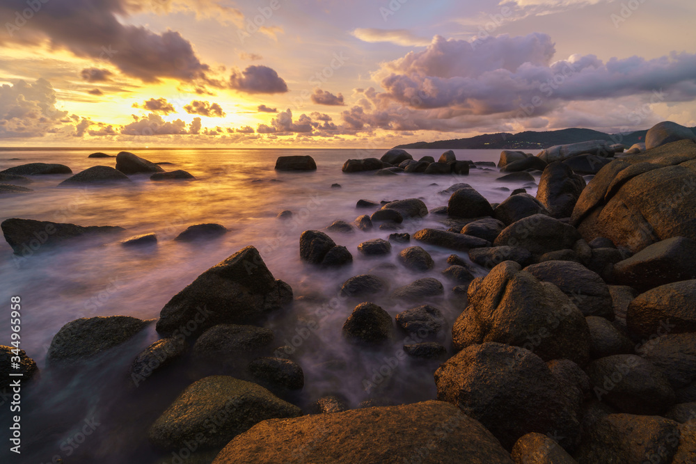 landscape long exposure Sunset beach and sea rock