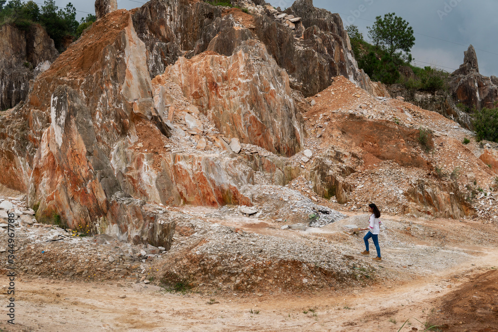 Teenage girl travelling in a rocky structure Teenage girl travelling in a rocky structure