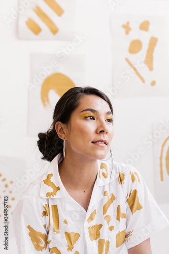 portrait of young woman with hand painted clothing