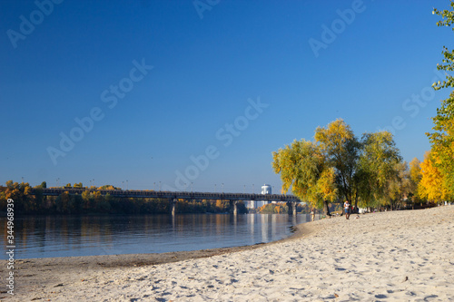view of bereznyaky beach in a sunny autumn day, Kyiv, Ukraine © Tomtsya