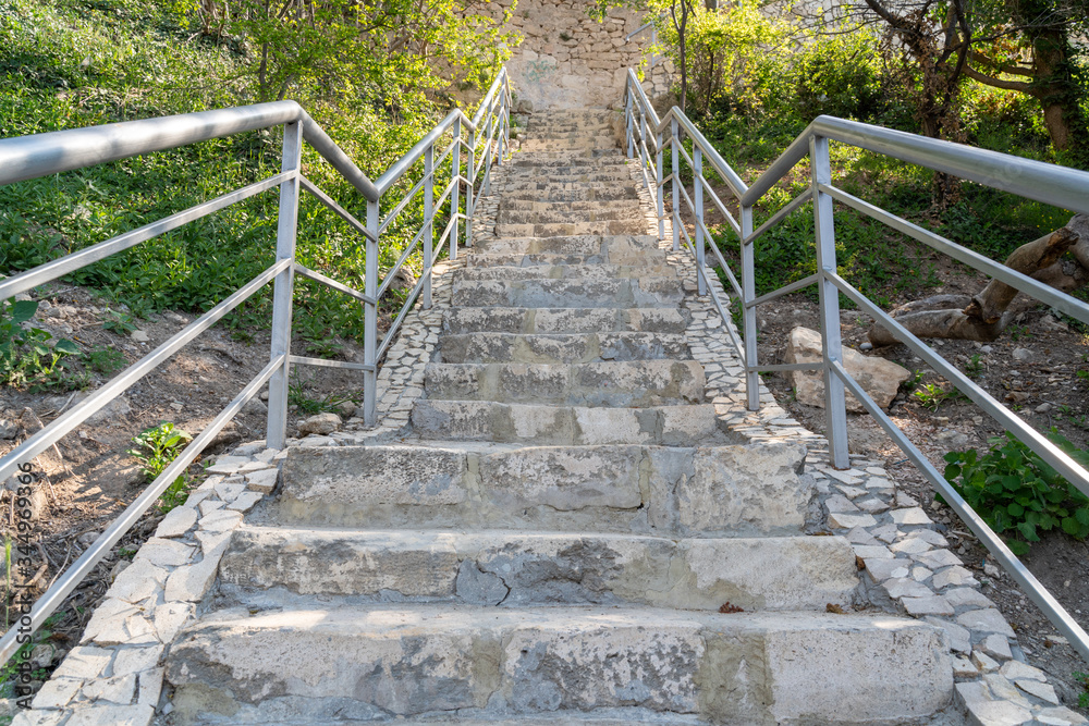 A new stone staircase of 800 steps to Jasper Beach, built in the spring of 2020. The reserve on the Black Sea. Cape Fiolent, Crimea Peninsula. The concept of unity with nature, outdoor activities. A new stone staircase of 800 steps to Jasper Beach, built in the spring of 2020. The reserve on the Black Sea. Cape Fiolent, Crimea Peninsula. The concept of unity with nature, outdoor activities.