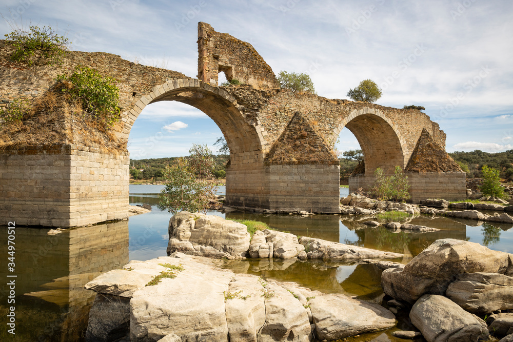 ruins of the Ajuda bridge over the Guadiana river in the ancient road between Elvas and Olivenza, Extremadura, Portugal/Spain