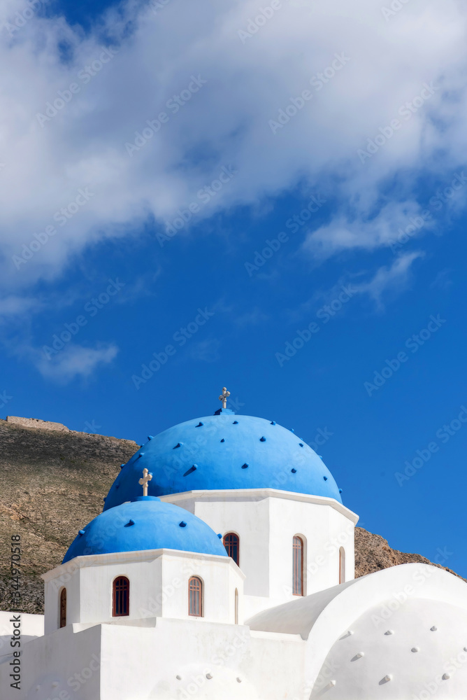 Blue domes of an Orthodox Church at sunrise in Santorini, Greece