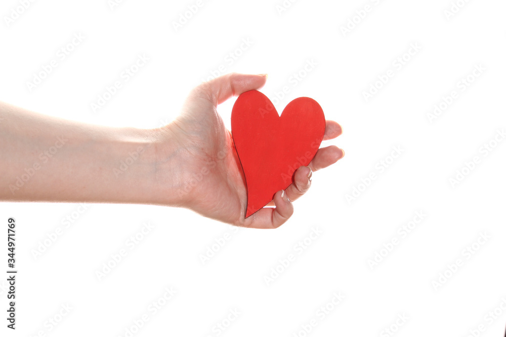 Obraz premium Woman hand holds a red heart