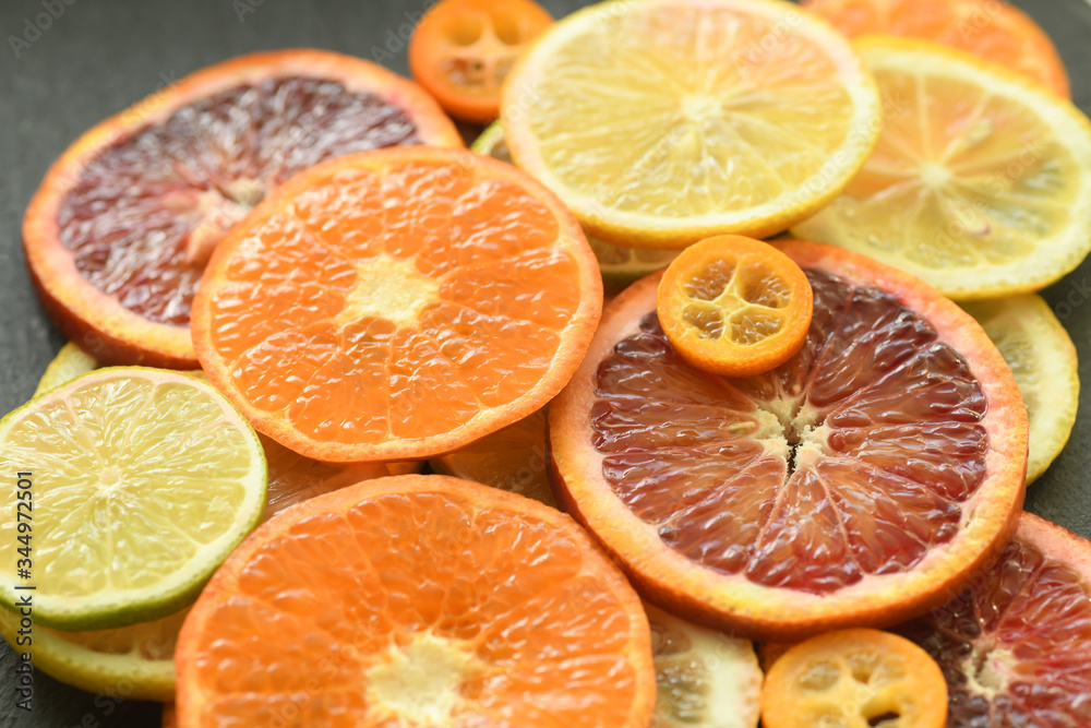 Ripe red orange lemon kumquat lime thin slices Ripe red orange lemon kumquat lime thin slices
