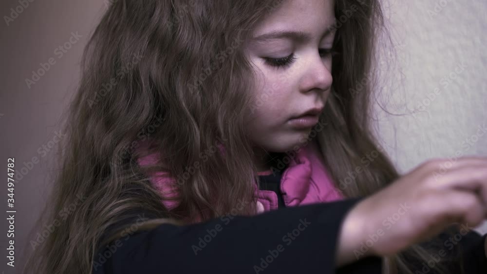 Upset child. Little girl grumpy. Child abuse concept. Tears on the face ...