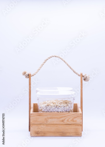 Donation box  with oatmeal. Food supplies, food stock for quarantine, isolation period on white. Donation, coronavirus