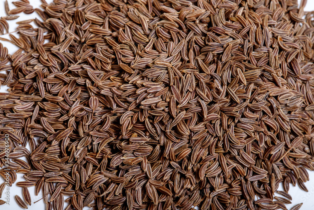 Pile of cumin seeds isolated on white background Pile of cumin seeds isolated on white background