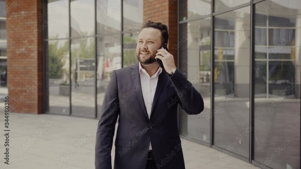 Business man talking on cell phone Business man talking on cell phone