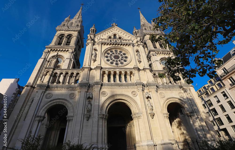 The Saint-Ambroise church soars into blue sky in French capital Paris.