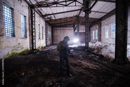 Rebel inmask armed with AK in destroyed factory © yurbeck