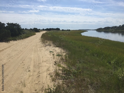 dirt road to the sea by salt pond marsh on Chappaquiddick Martha's Vineyard