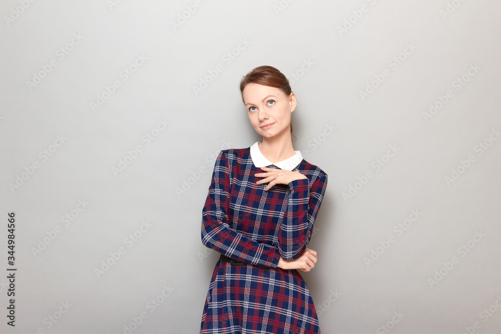 Portrait of thoughtful dreamy girl being deep in thoughts and dreaming