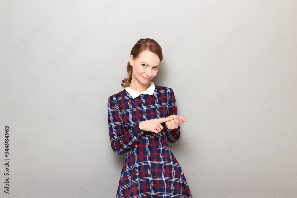 Portrait of happy young woman making list of something with fingers Portrait of happy young woman making list of something with fingers