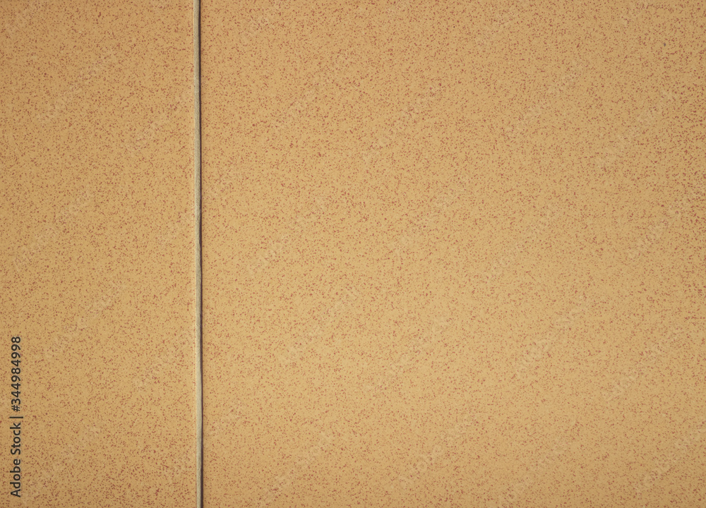 Fototapeta premium Beige wall tiles with inclusions