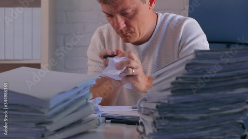 Office clerk working paperwork and files from home, work overload and bureaucracy concept