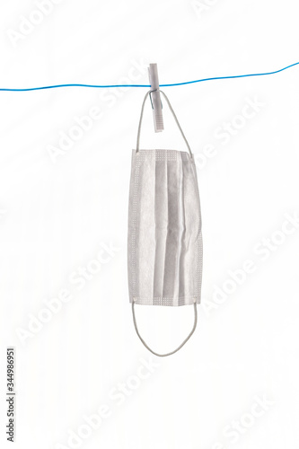 To dry the face mask by hanging it on a rope