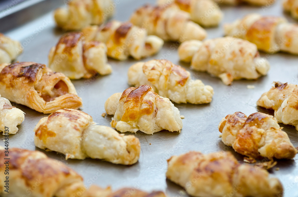 Fresh croissants on a tray, ready for serving Fresh croissants on a tray, ready for serving