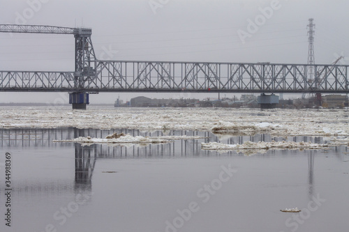 bridge over the river where the ice floe runs © eevlada
