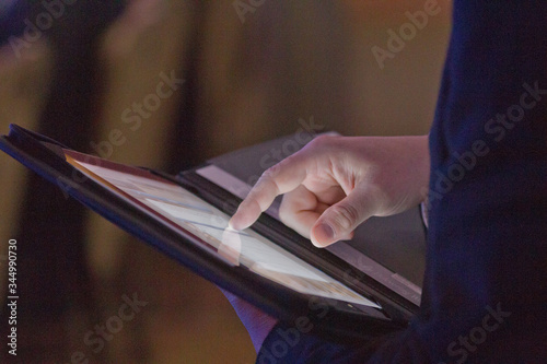 Murais de parede Closeup of fingers browsing tablet, iPad